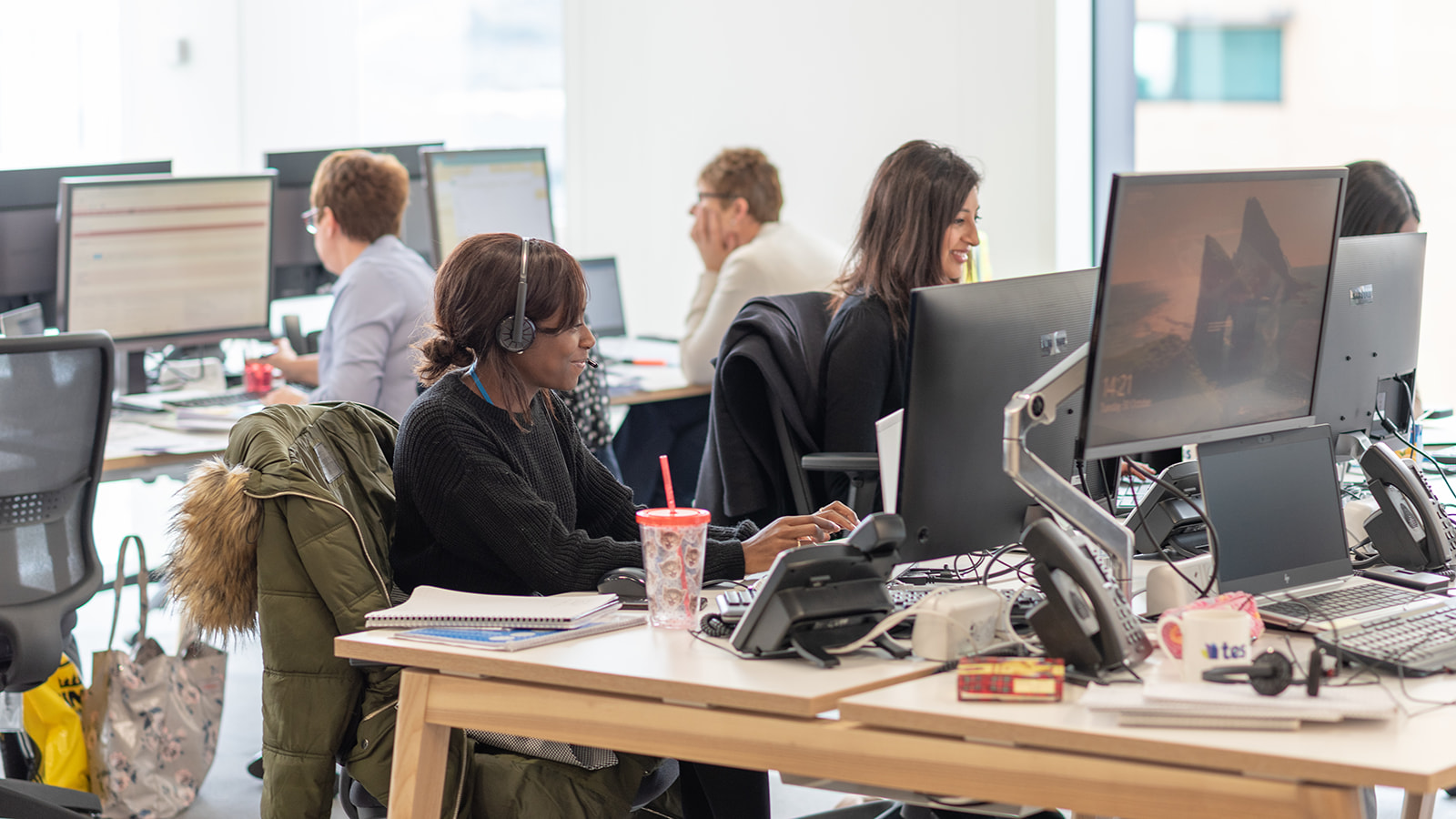 Tes colleagues working at their desks in a Tes office