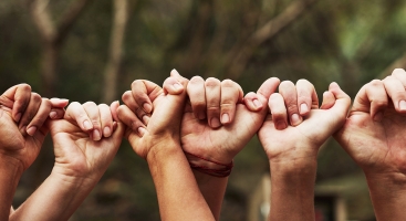 Hands linked together